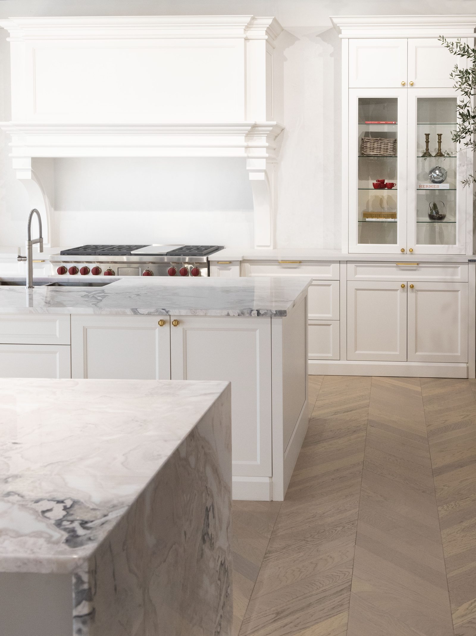 Classic white luxury kitchen remodel with marble island