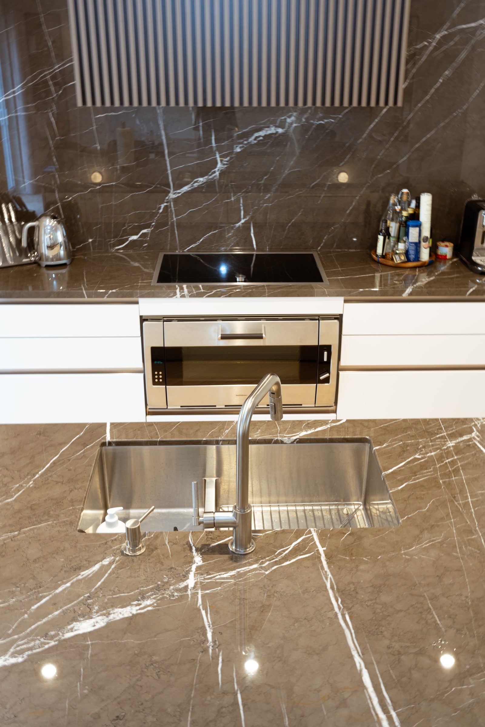 Custom kitchen with dark marble backsplash