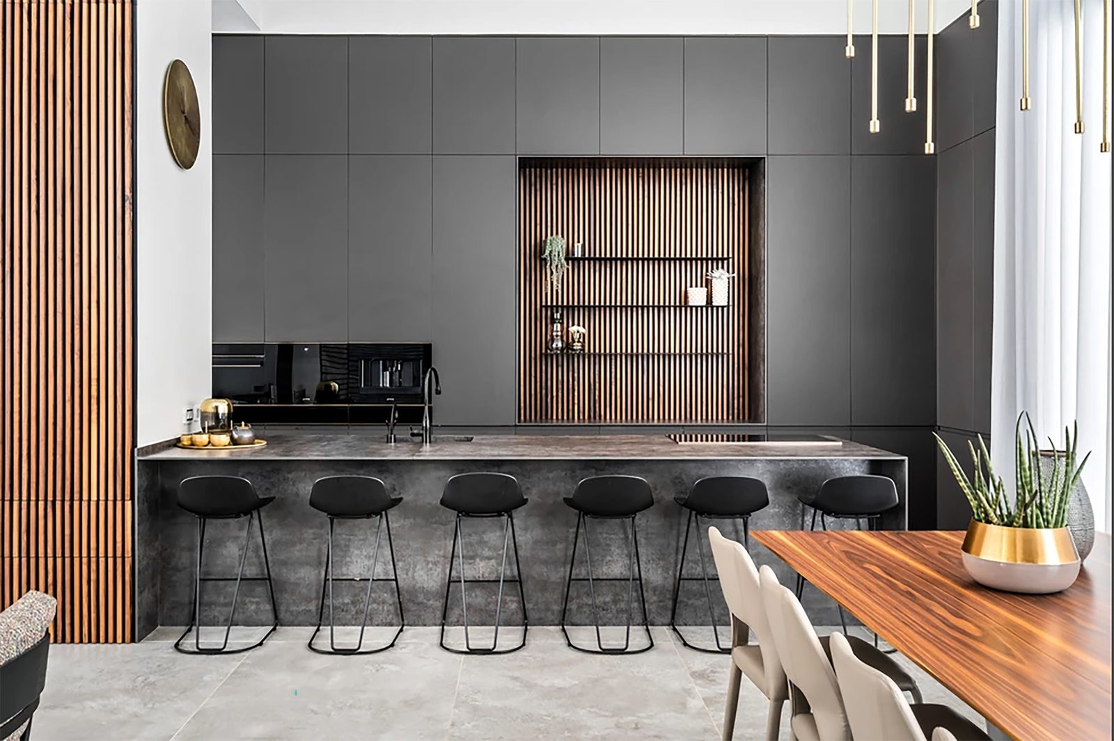 Dark wood luxury kitchen island with bar seating — Xpert Construction project