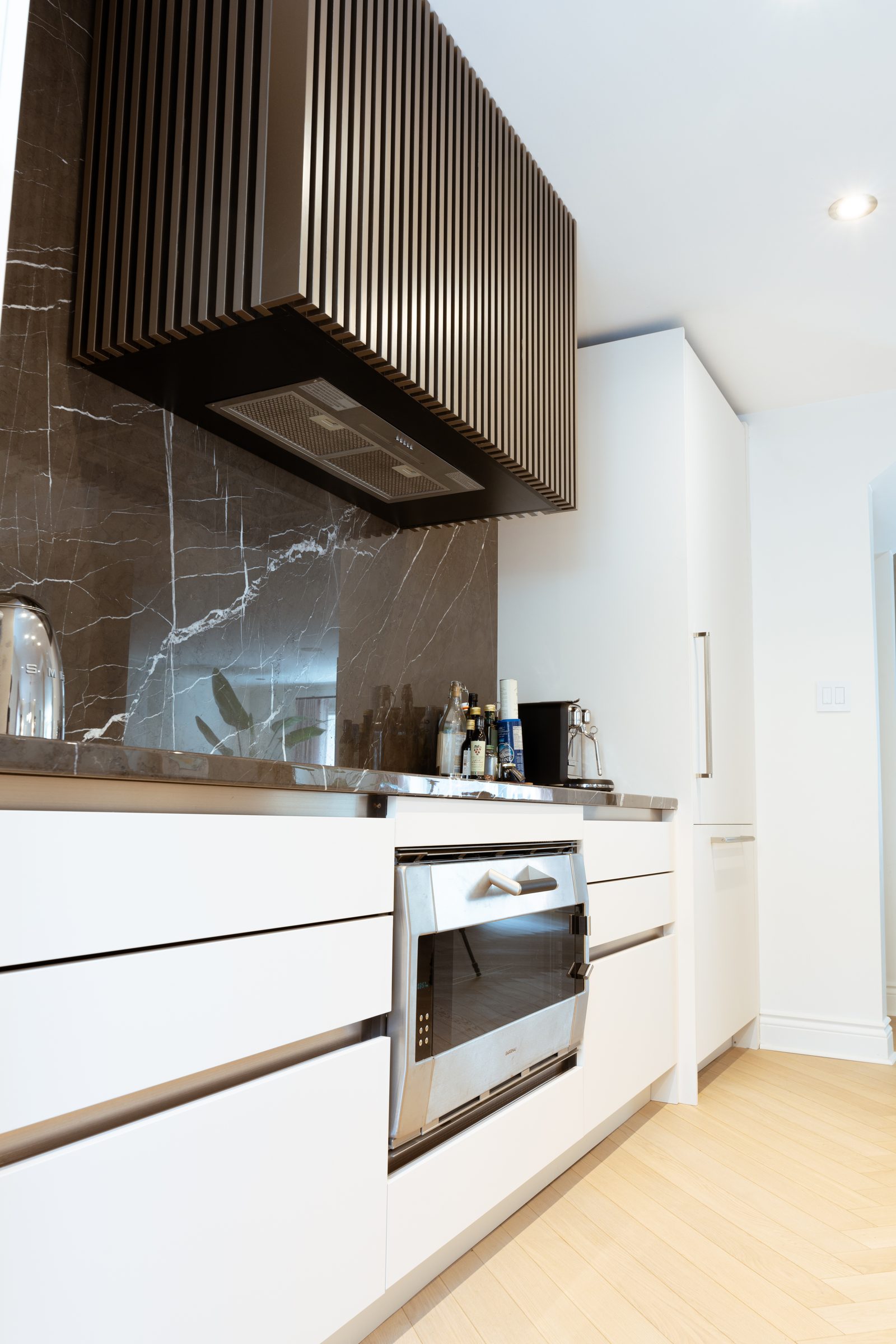 Luxury kitchen with wood hood and white cabinetry
