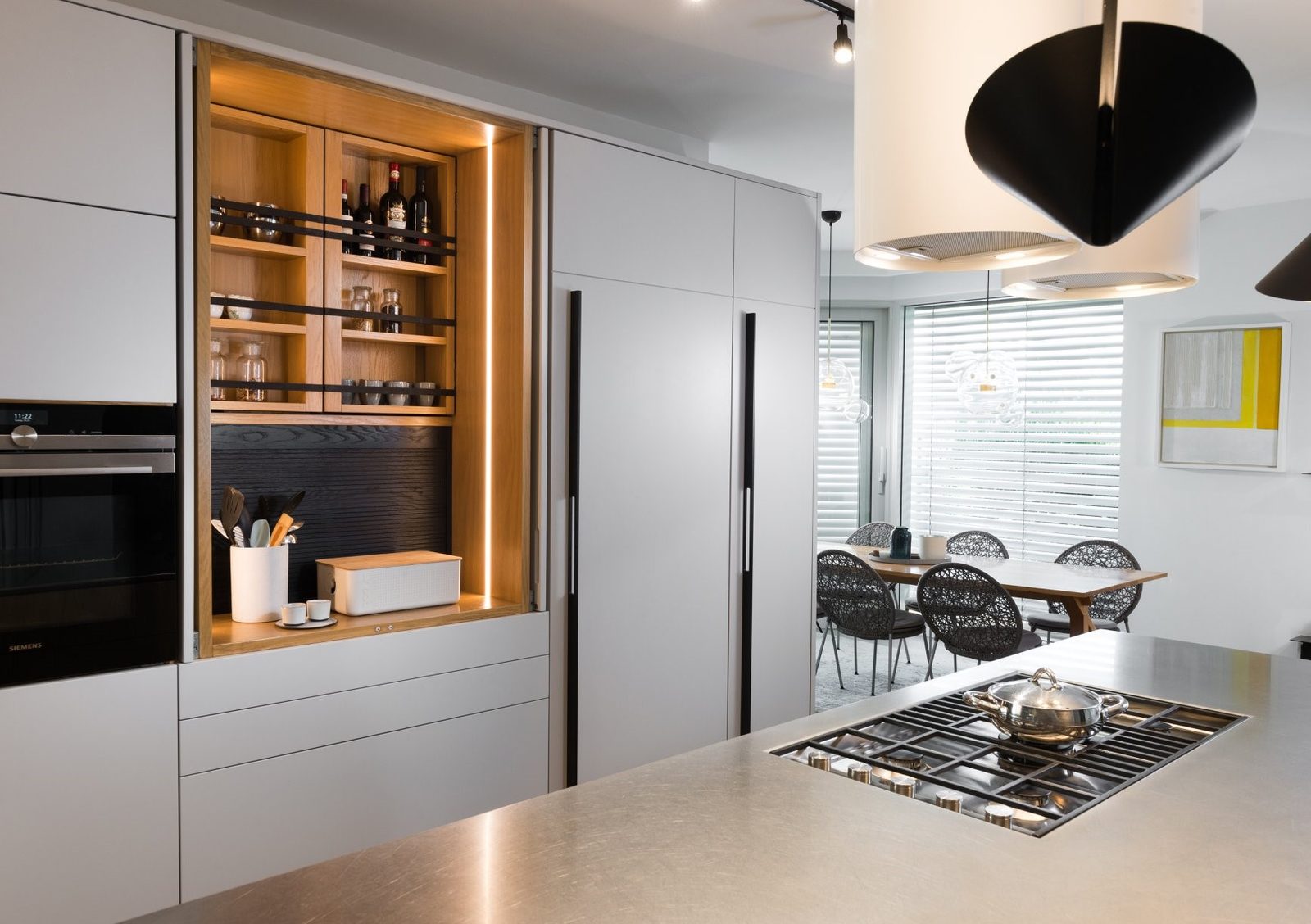 White oak kitchen with built-in ovens