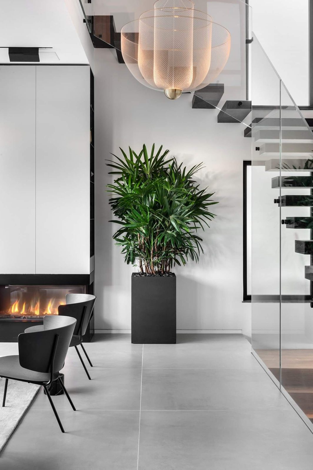 Floating stair in a double-height hallway