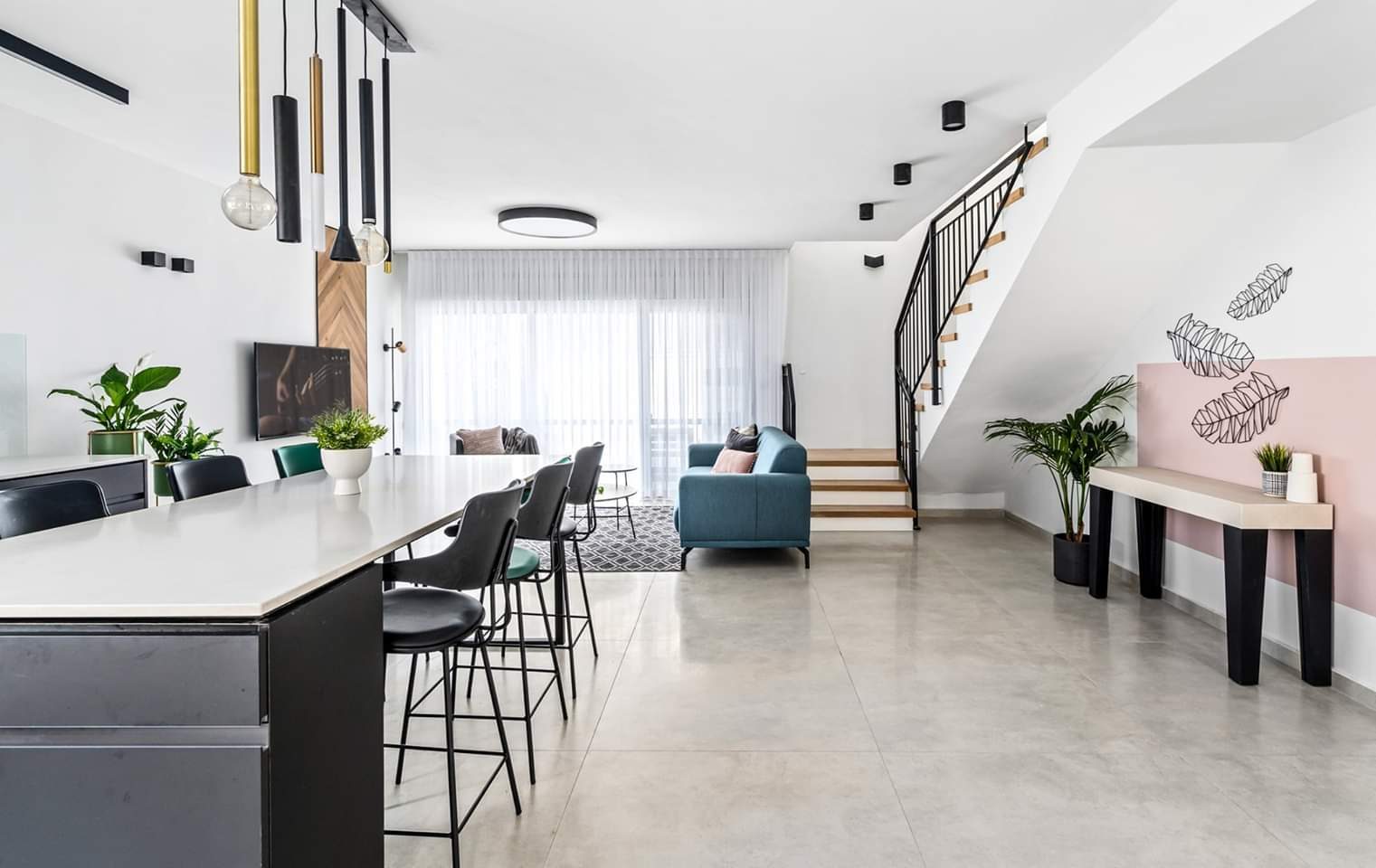 Open-plan ground floor with a feature stair after a whole-home renovation