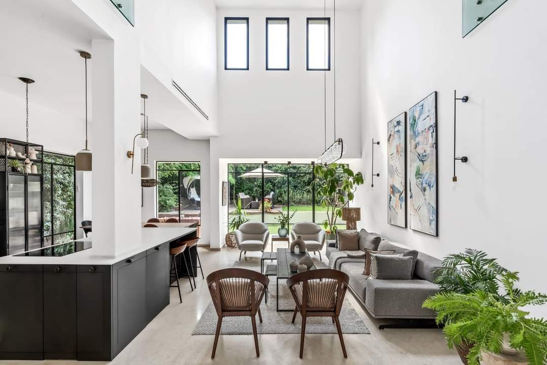 Double-height open-plan living area in a custom home