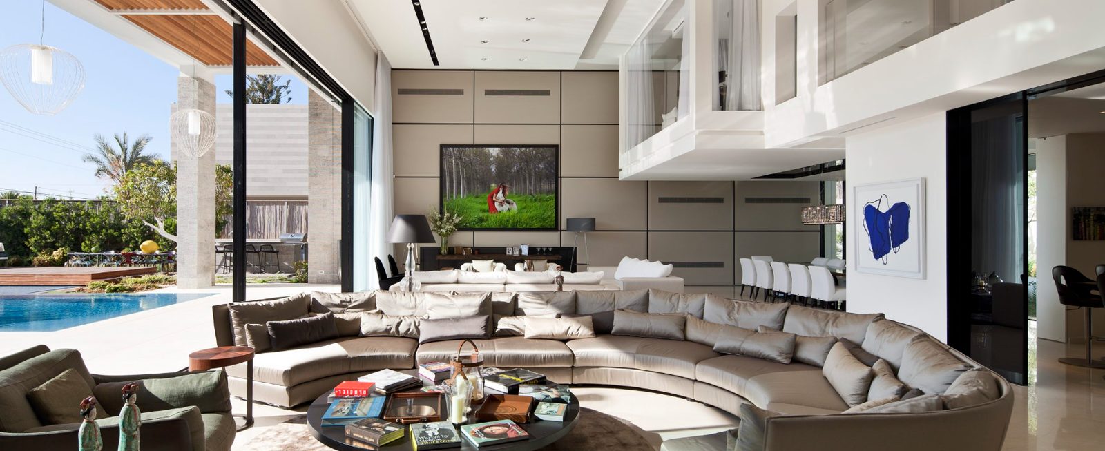Living space opening onto the pool terrace of a custom home