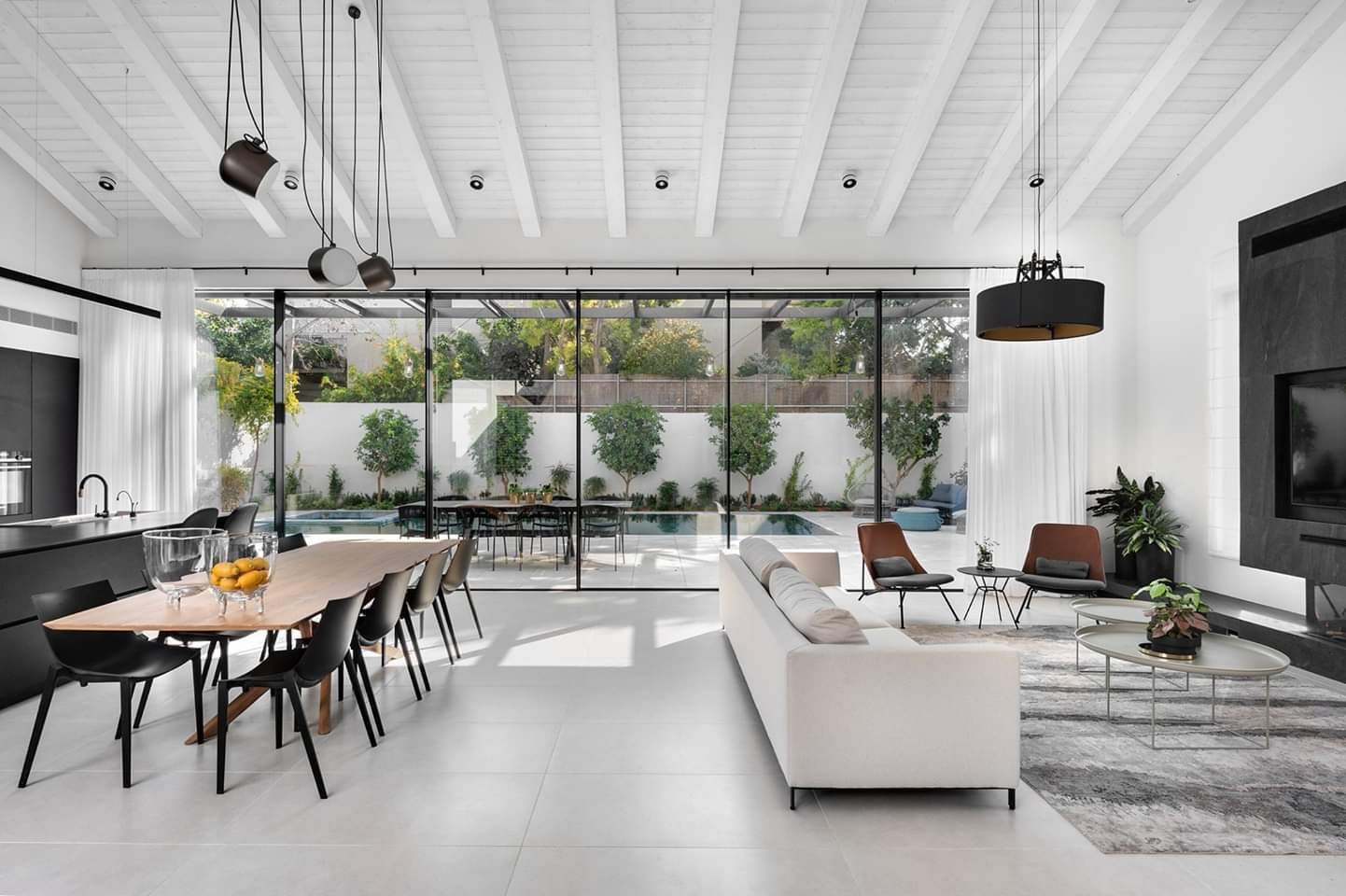 Dining room under a vaulted ceiling with garden glazing