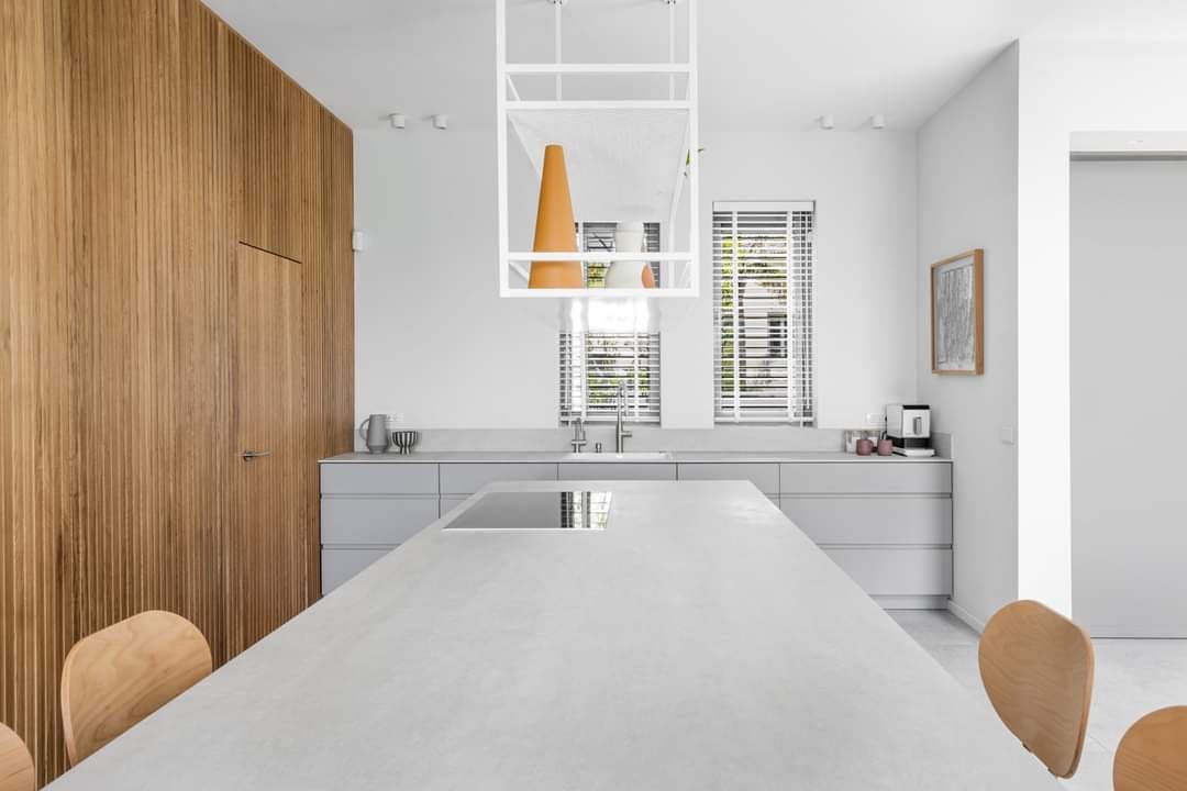 White kitchen island in an open-plan family home