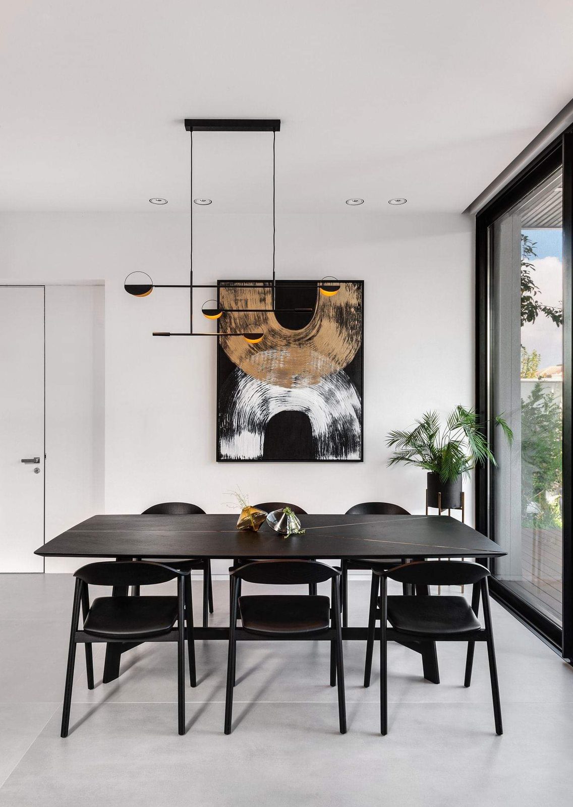Dining room with full-height glazing in a renovated villa