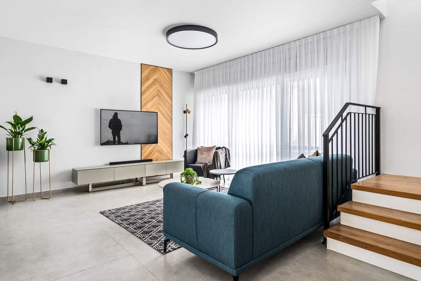 Living room with a built-in media wall after renovation