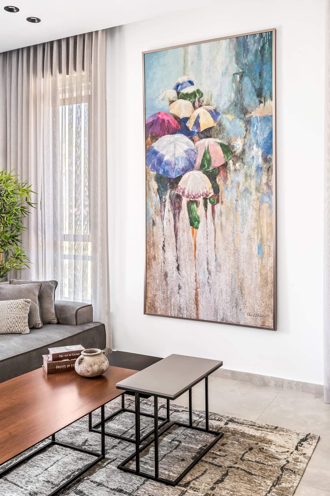 Living room framed by full-height walnut joinery